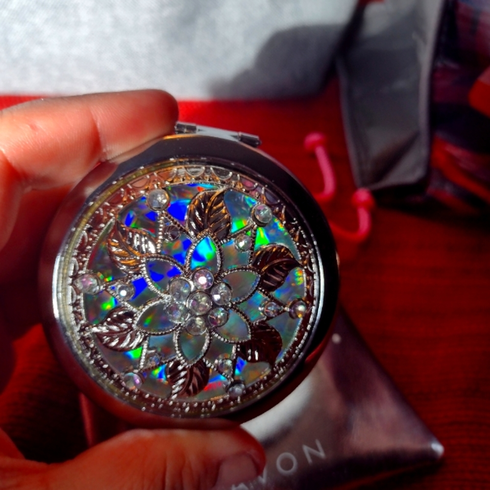 Brand New Avon compact mirror with pouch